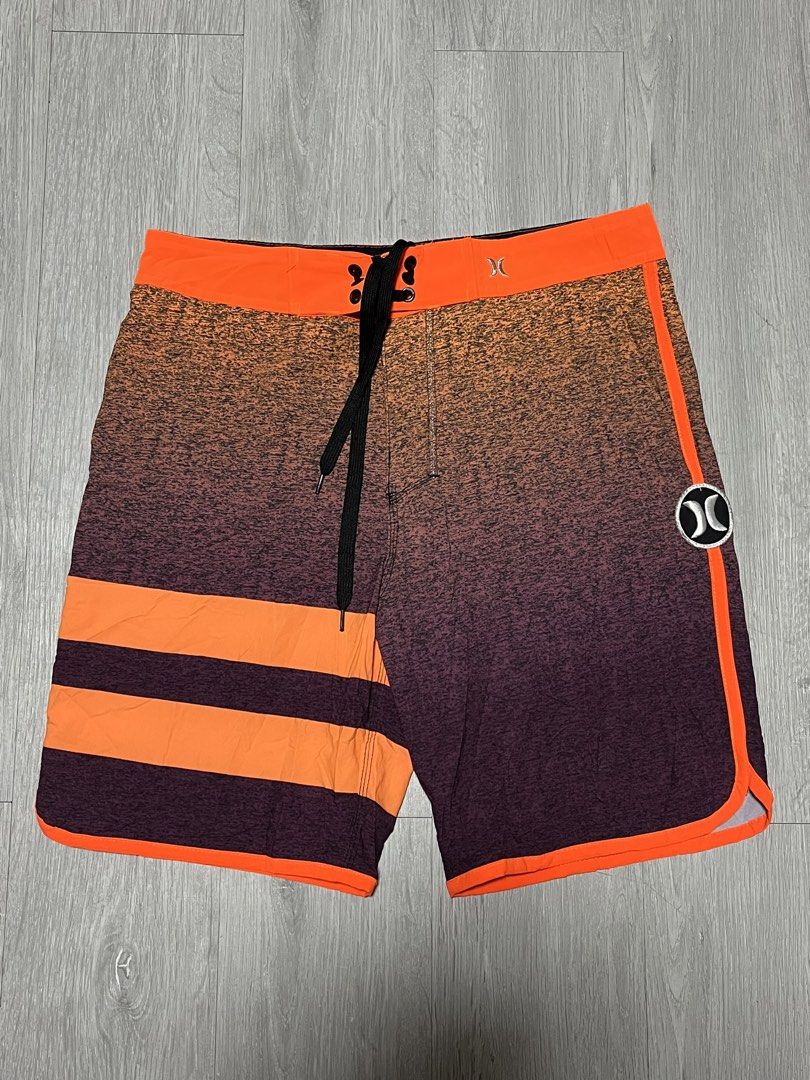 Hurley Phantom Orange Gradient Boardshorts Swim Trunks (Category: Swim Trunks & Board Shorts) located in Manila. Submitted by jorgemabelin2001 (Listing ID 1470697912, Image 1). Description: - Brand: Hurley Phantom - Design: Cool orange to dark purple gradient heather effect - Details: Bright orange waistband, side piping, and back pocket flap - Closure: Black lace-up drawstring with metal grommets - Pocket: Single back pocket with flap and button