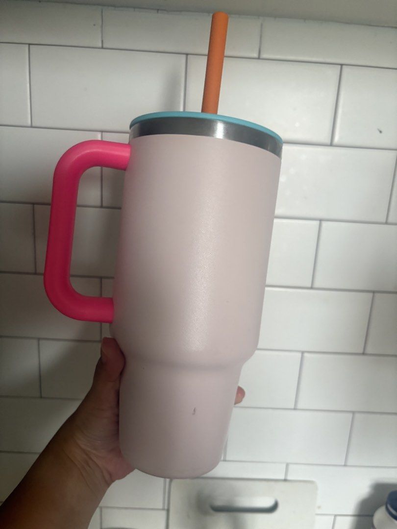 Hydro Flask 32oz (Category: Water Bottles & Tumblers) located in Manila. Submitted by mndoxajc (Listing ID 1470585250, Image 2). Description: - Authentic Hydro Flask Travel Tumbler - Eye-catching color combo: pink body, bright pink handle, light blue lid, and orange straw - Large capacity, ideal for water or iced coffee on the go - TempShield insulation keeps drinks cold all day - Condition: Works great, with a minor scuff mark on the lower back 