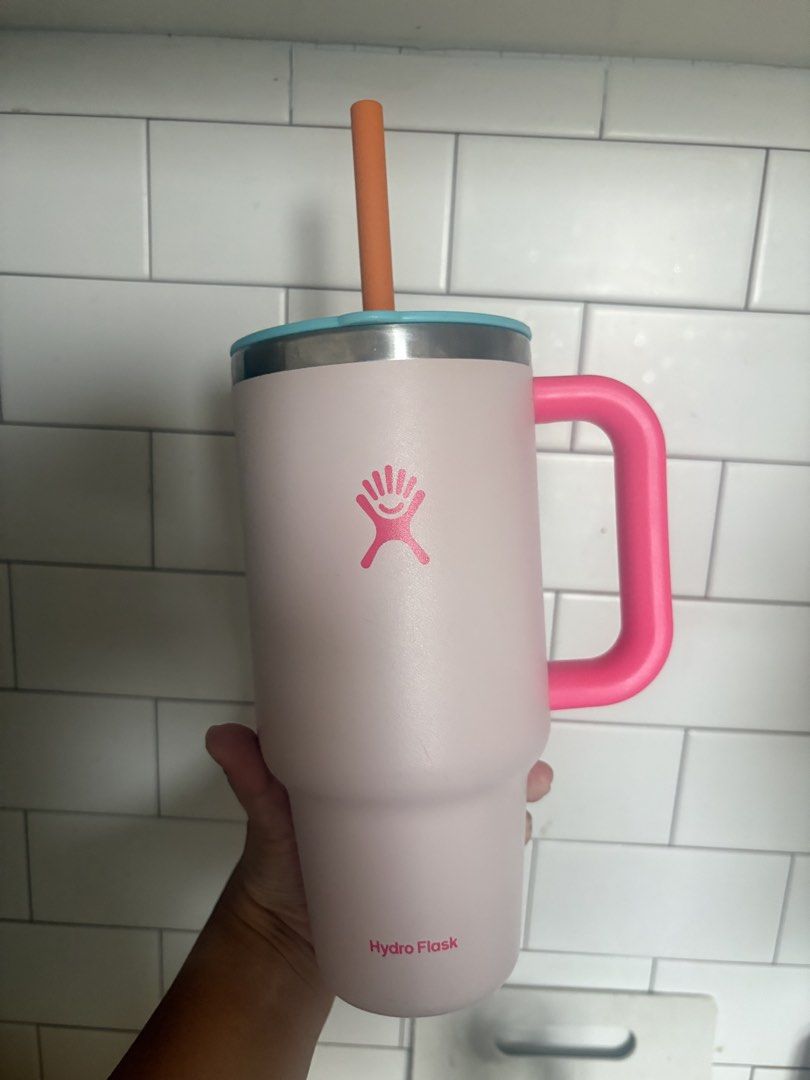 Hydro Flask 32oz (Category: Water Bottles & Tumblers) located in Manila. Submitted by mndoxajc (Listing ID 1470585250, Image 1). Description: - Authentic Hydro Flask Travel Tumbler - Eye-catching color combo: pink body, bright pink handle, light blue lid, and orange straw - Large capacity, ideal for water or iced coffee on the go - TempShield insulation keeps drinks cold all day - Condition: Works great, with a minor scuff mark on the lower back 