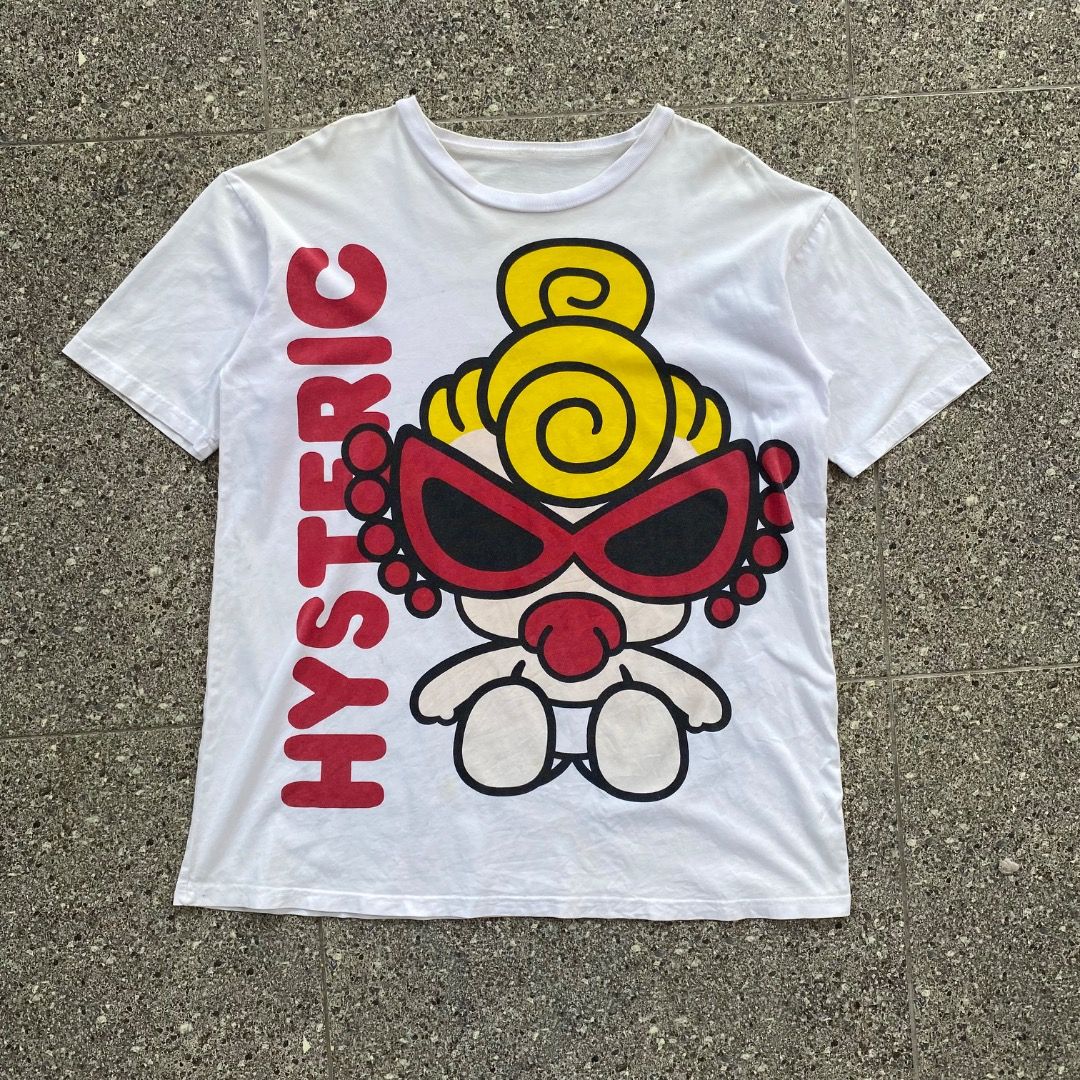 Hysteric Glamour Graphic Tee (Category: Tshirts & Polo Shirts ) located in Caloocan City. Submitted by heisenrags.dept (Listing ID 1470561744, Image 1). Description: White Hysteric Glamour graphic t-shirt with large prints on both sides. Front has a character design with red lettering running vertically. Back features a pink bear-suited character with black Glamour text on the left. Short sleeves, crew neck. Bold vintage streetwear look..