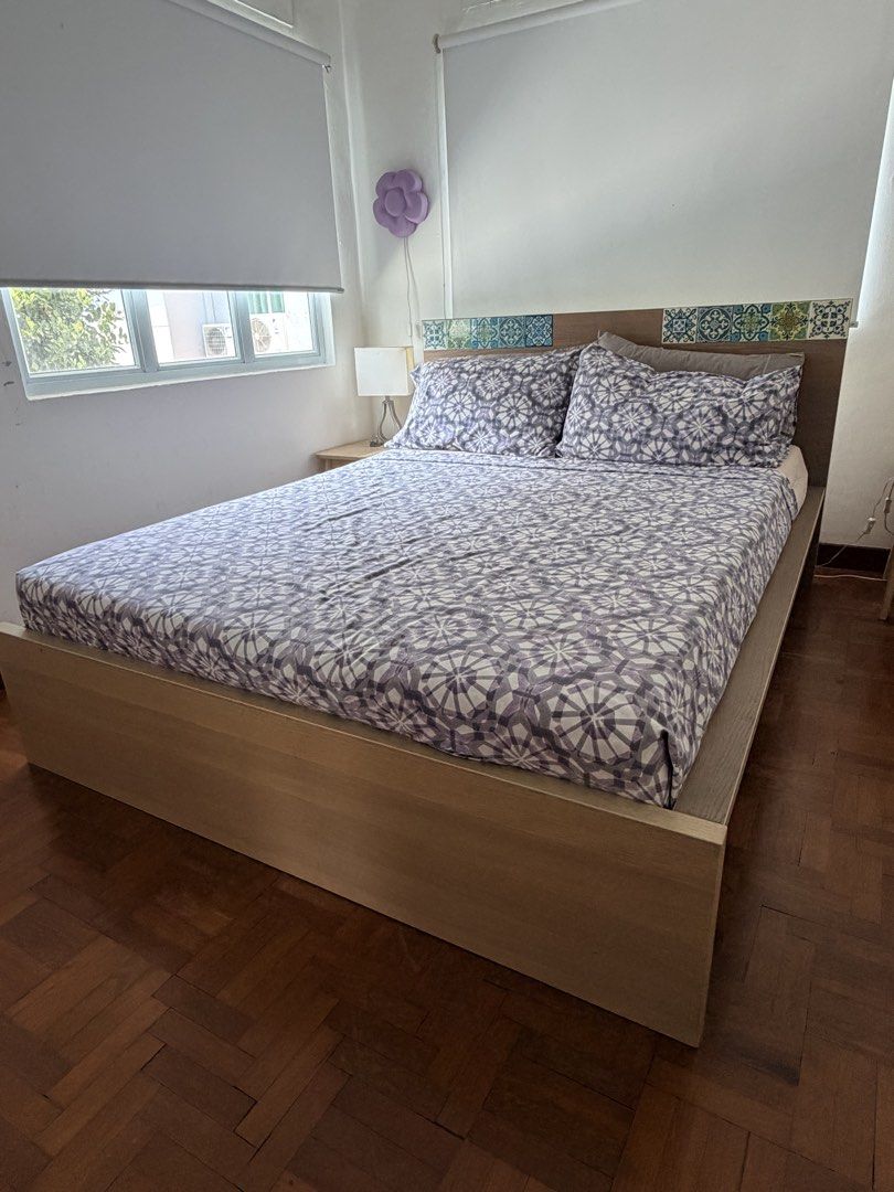 IKEA bed frame (Category: Bed Frames & Mattresses) located in Singapore. Submitted by ashhux (Listing ID 1470579708, Image 1). Description: - Sturdy platform bed frame - Fits Queen mattresses - Features a built-in headboard - Self-collection and dismantling required (buyer to handle).