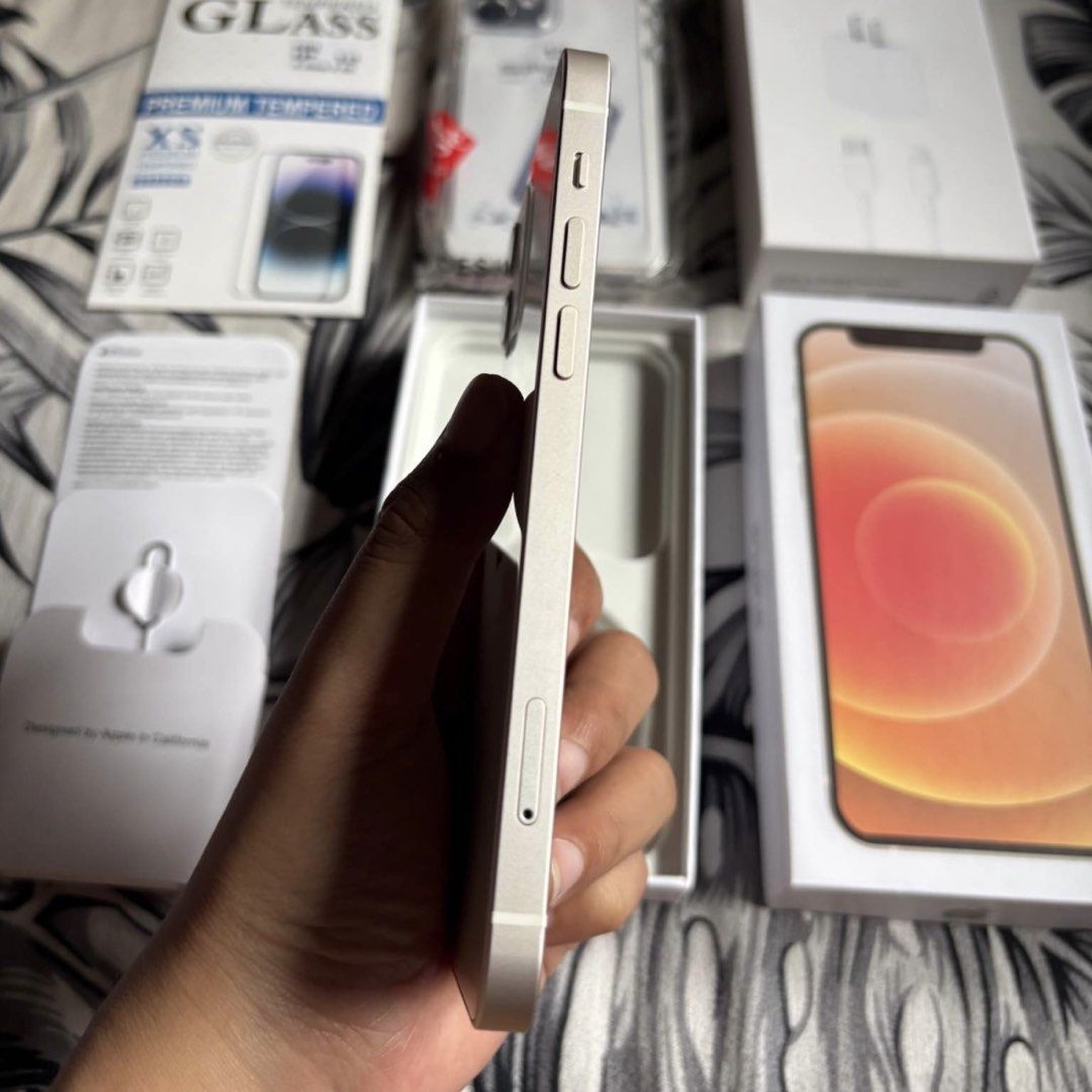 IPHONE 12 128 GB WHITE (Category: iPhone 12 Series) located in Bauang. Submitted by vantro_gadgets (Listing ID 1470559753, Image 3). Description: 🔥 iPhone 12 | 128GB 📱 💰 PRICE: ₱18,500 — FIXED ❌ No Lowballers, Please! ✅ Factory Unlocked | Any SIM 🔋 100% Battery Health* ✅ Face ID & True Tone Working* 📊 3uTools Report Available 📦 Box & Charger Included 🎁 Free Case & Tempered Glass 🤝 Reseller: Ashley Savilla 💬 Message me to order! Features 