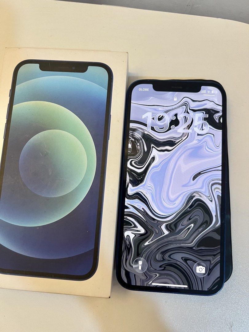 iPhone 12 128gb (Blue) (Category: iPhone 12 Series) located in Taguig. Submitted by 04.nmm (Listing ID 1470701384, Image 3). Description: Selling my bf’s iPhone 12 128gb True Tone Working Face ID Working 68% Battery Health (Needs Service) No history of repair Globelocked (Globe/TM/Gomo sim working) With original box and cases Honest issue: Paint chips on the side of the unit (only Cosmetic issue) All working, ready to use ✅ Rfs: Upgrade.