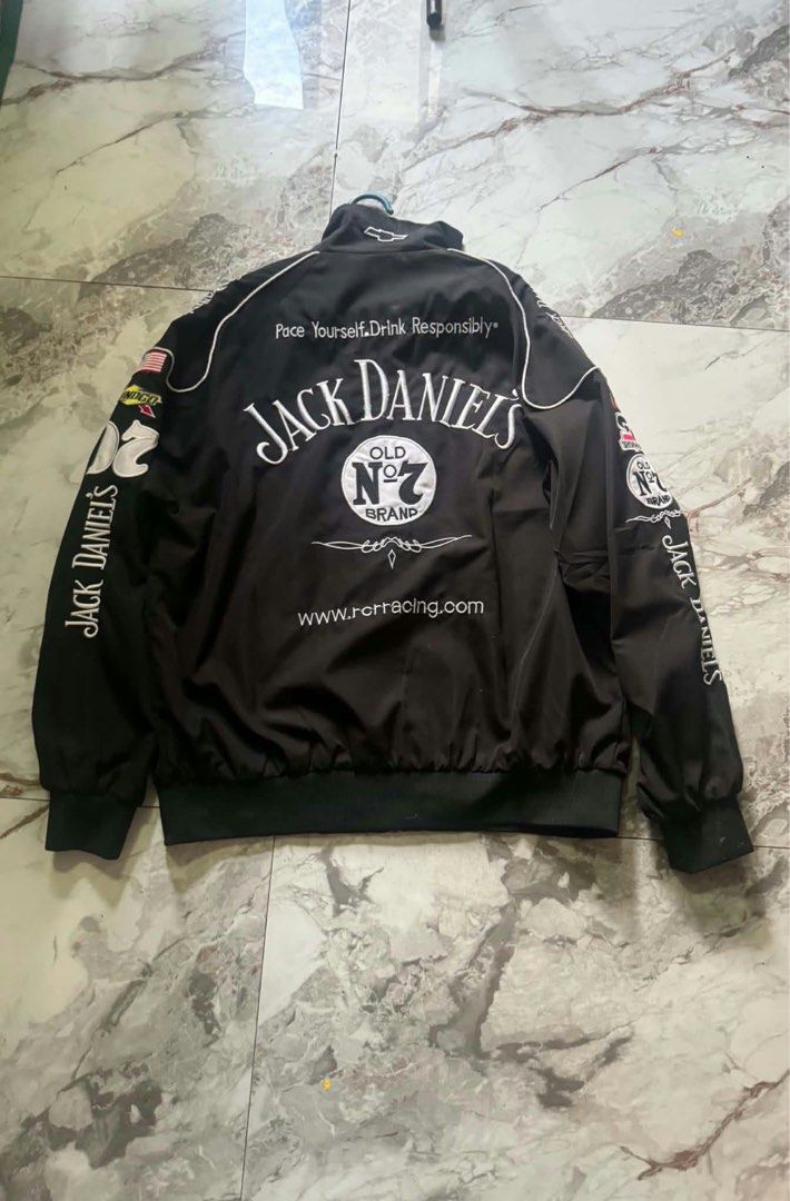 Jack Daniel's Racing NASCAR Black Bomber Jacket (Category: Coats, Jackets and Outerwear) located in Taguig. Submitted by safestorm.68a583 (Listing ID 1470694622, Image 2). Description: - Authentic Black Jack Daniel's racing jacket - Big embroidered Old No. 7 logo on the front and back - Detailed sponsor patches including Snap-on and NASCAR Nextel Cup Series on the chest and sleeves - Full zip closure with a stylish high collar - Ribbed cuffs and 