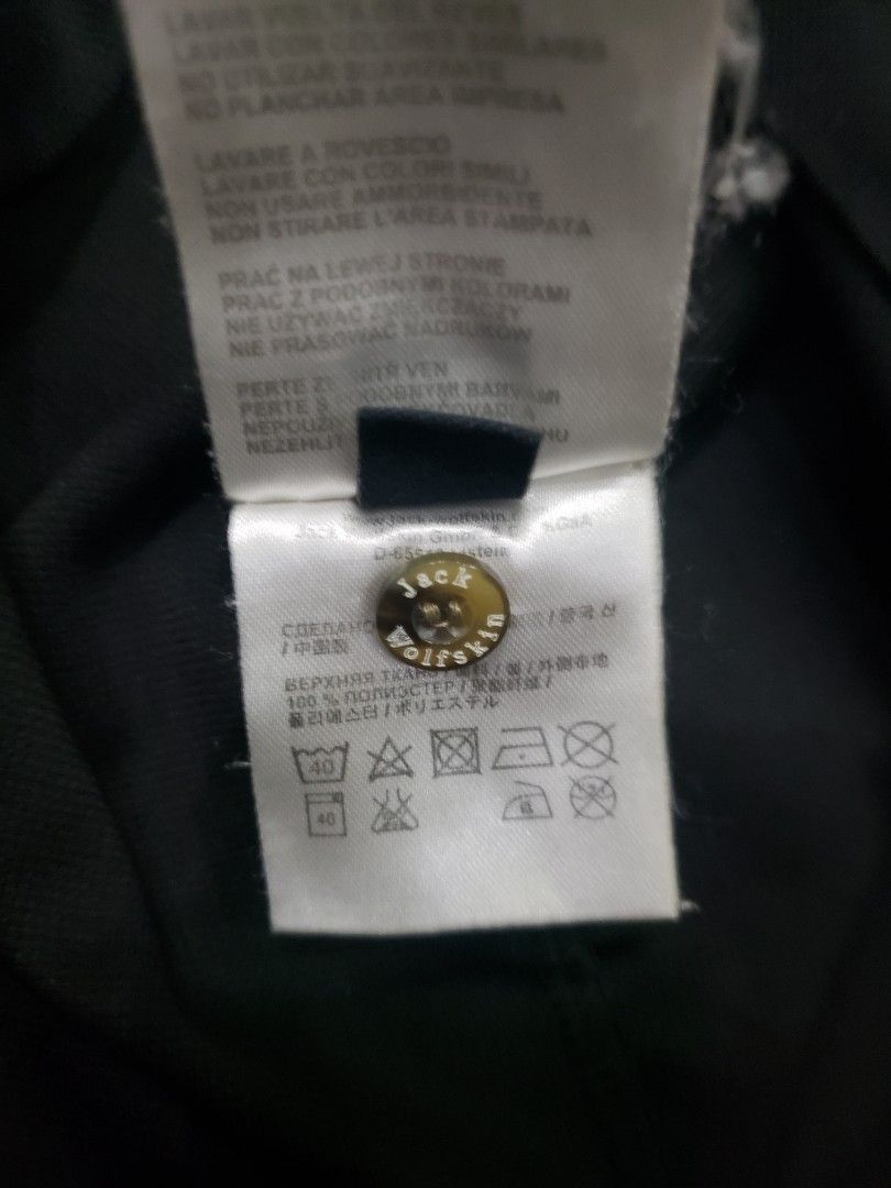 Jack Wolfskin Black Polo Shirt (Category: Tshirts & Polo Shirts ) located in Pagsanghan. Submitted by yuchinz (Listing ID 1470661661, Image 2). Description: - Brand: Jack Wolfskin - Color: Black - Material: 100% breathable polyester (easy to wash & maintain) - Design: Classic collar, 3-button placket, short sleeves - Details: Small logo on chest, large wolf paw outline graphic on the back - Condition: Excellent / Great for casual wear and outdoor
