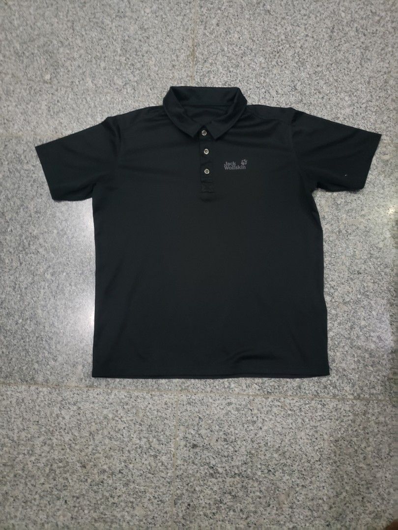 Jack Wolfskin Black Polo Shirt (Category: Tshirts & Polo Shirts ) located in Pagsanghan. Submitted by yuchinz (Listing ID 1470661661, Image 1). Description: - Brand: Jack Wolfskin - Color: Black - Material: 100% breathable polyester (easy to wash & maintain) - Design: Classic collar, 3-button placket, short sleeves - Details: Small logo on chest, large wolf paw outline graphic on the back - Condition: Excellent / Great for casual wear and outdoor