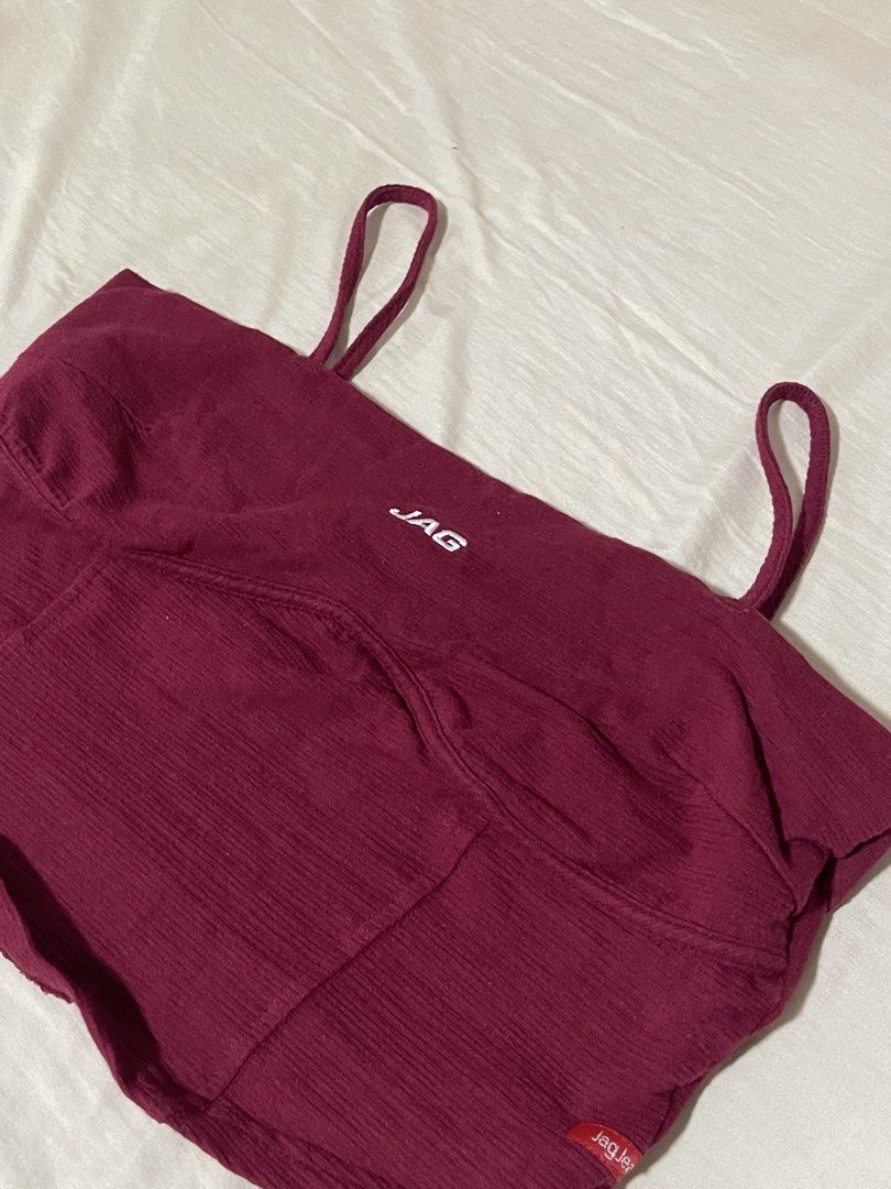 JAG Jeans Maroon Cropped Cami Top Size M (Category: Sleeveless) located in Caloocan City. Submitted by sheshesheshesheshe13 (Listing ID 1470714015, Image 2). Description: - Brand: JAG Jeans - Size: Medium (tag attached) - Color: Maroon with white logo near the neckline - Design: Thin shoulder straps, textured fabric throughout, and red brand label on the bottom hem - Condition: Brand new.