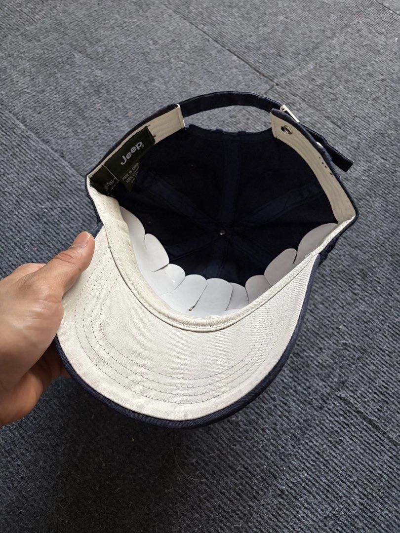 Jeep Legend Navy Blue Baseball Cap (Category: Caps & Hats) located in Manila. Submitted by toys_hats005 (Listing ID 1470628518, Image 3). Description: - Brand: Jeep Legend - Color: Navy blue - Design: Embroidered star and '1941' patch on front - Material: 100% cotton - Fit: Adjustable strap with metal buckle - Details: Contrast white brim lining, green inner tag (Made in China) - Condition: Excellent / Pre-loved - Shipping or meetups available (M