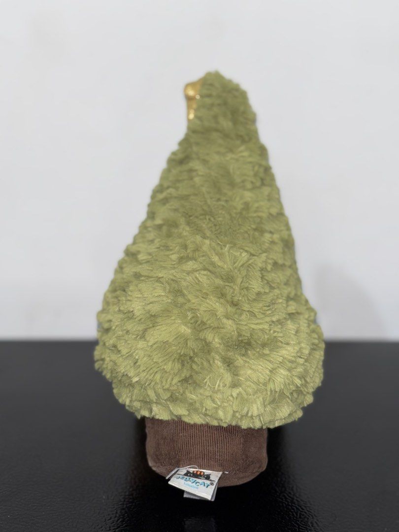 Jellycat Amuseable Christmas Tree Plush (Category: Plushies & Soft Toys) located in Cavite. Submitted by eleanordc (Listing ID 1470724796, Image 2). Description: - Authentic Jellycat Christmas tree plush toy with original brand tags attached - Soft green textured fur body with a charming brown corduroy trunk base - Topped with a festive, sparkly gold star - Features cute embroidered smile and little black bead eyes - Impeccable, clean condition i
