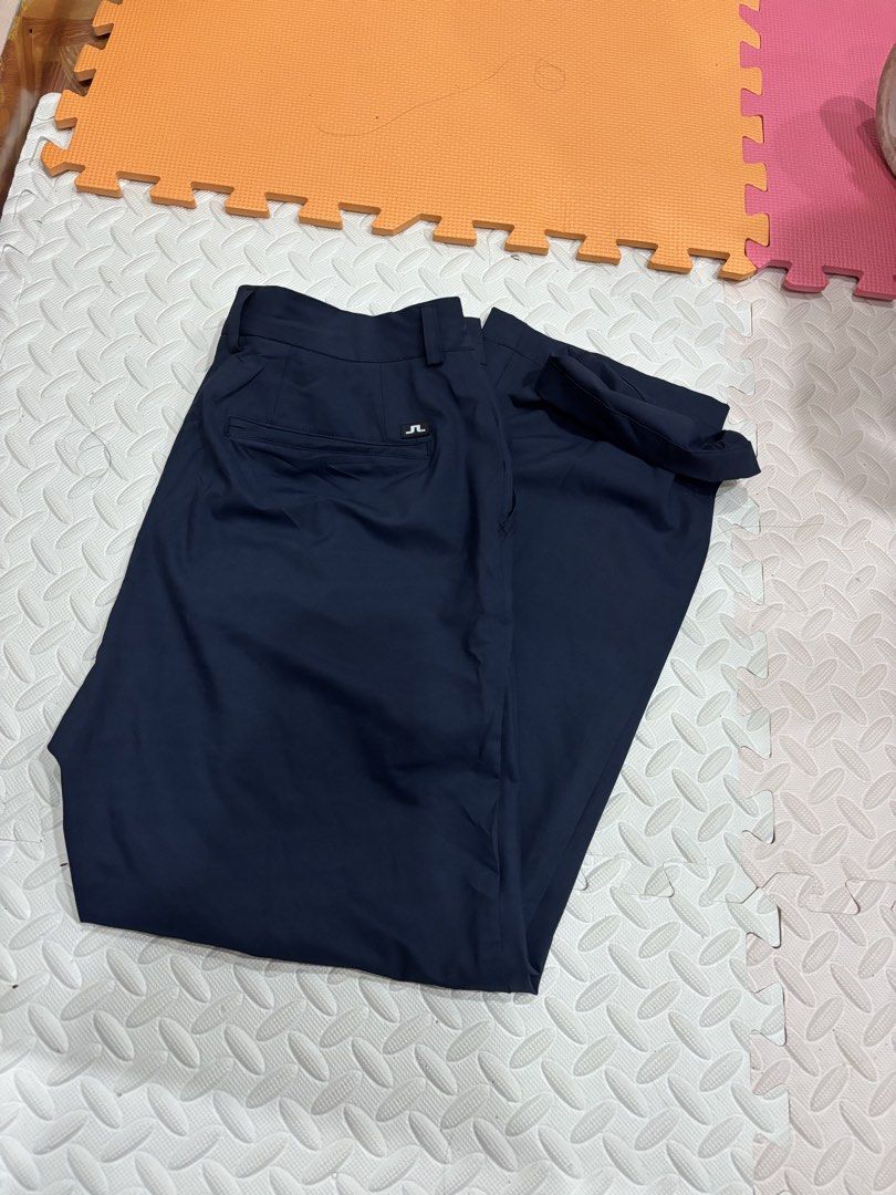 j.lindeberg W Key Micro Stretch Navy Pants Size 34 (Category: Trousers) located in Manila. Submitted by noribrahim.20 (Listing ID 1470694273, Image 3). Description: - Brand: J.Lindeberg (Model: W Key Micro Stretch) - Color: Navy blue - Size: 34 - Material: 100% polyester - Fit: Standard straight cut - Features: Dual back welt pockets, small logo tab, signature tricolor red, white, and blue interior waistband tape - Condition: Clean, minimal wear 