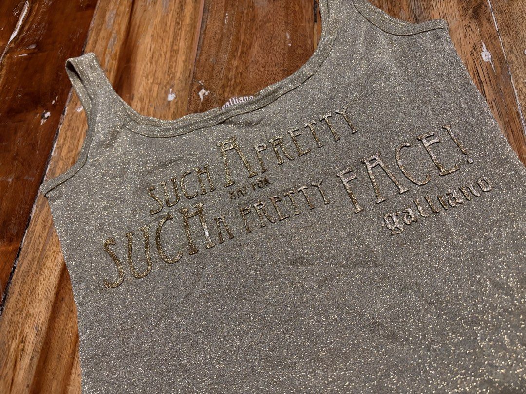 John Galliano 2000s metallic gold tanktop (Category: Sleeveless) located in Cagayan de Oro. Submitted by kirkwax_4 (Listing ID 1470633194, Image 3). Description: John Galliano 2000s Metallic gold tanktop Small (15x20.5) stretch Xcellent-like new No issue 5k.
