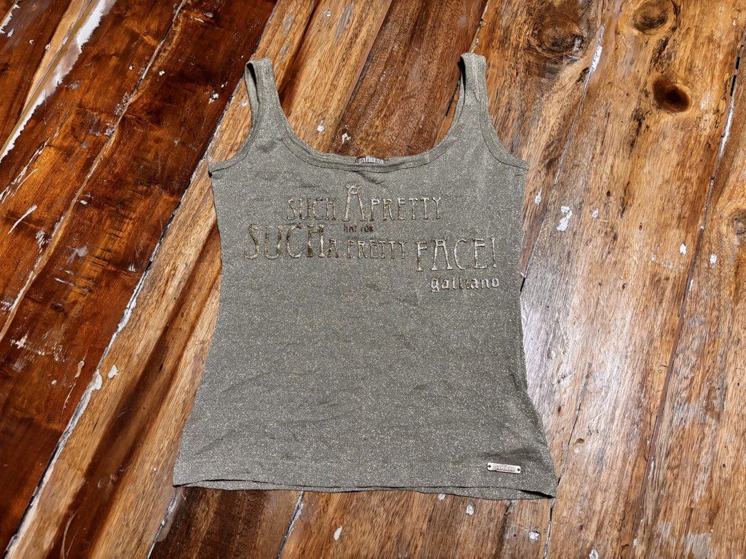 John Galliano 2000s metallic gold tanktop (Category: Sleeveless) located in Cagayan de Oro. Submitted by kirkwax_4 (Listing ID 1470633194, Image 1). Description: John Galliano 2000s Metallic gold tanktop Small (15x20.5) stretch Xcellent-like new No issue 5k.