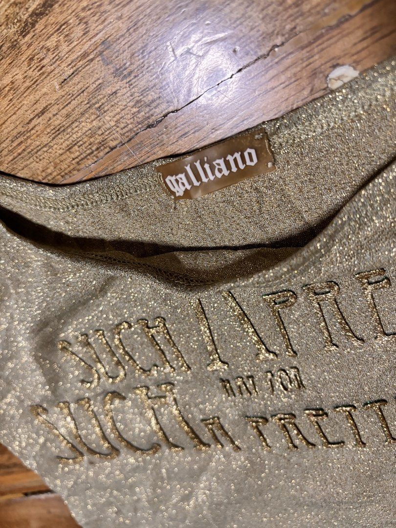 John Galliano 2000s metallic gold tanktop (Category: Sleeveless) located in Cagayan de Oro. Submitted by kirkwax_4 (Listing ID 1470633194, Image 2). Description: John Galliano 2000s Metallic gold tanktop Small (15x20.5) stretch Xcellent-like new No issue 5k.