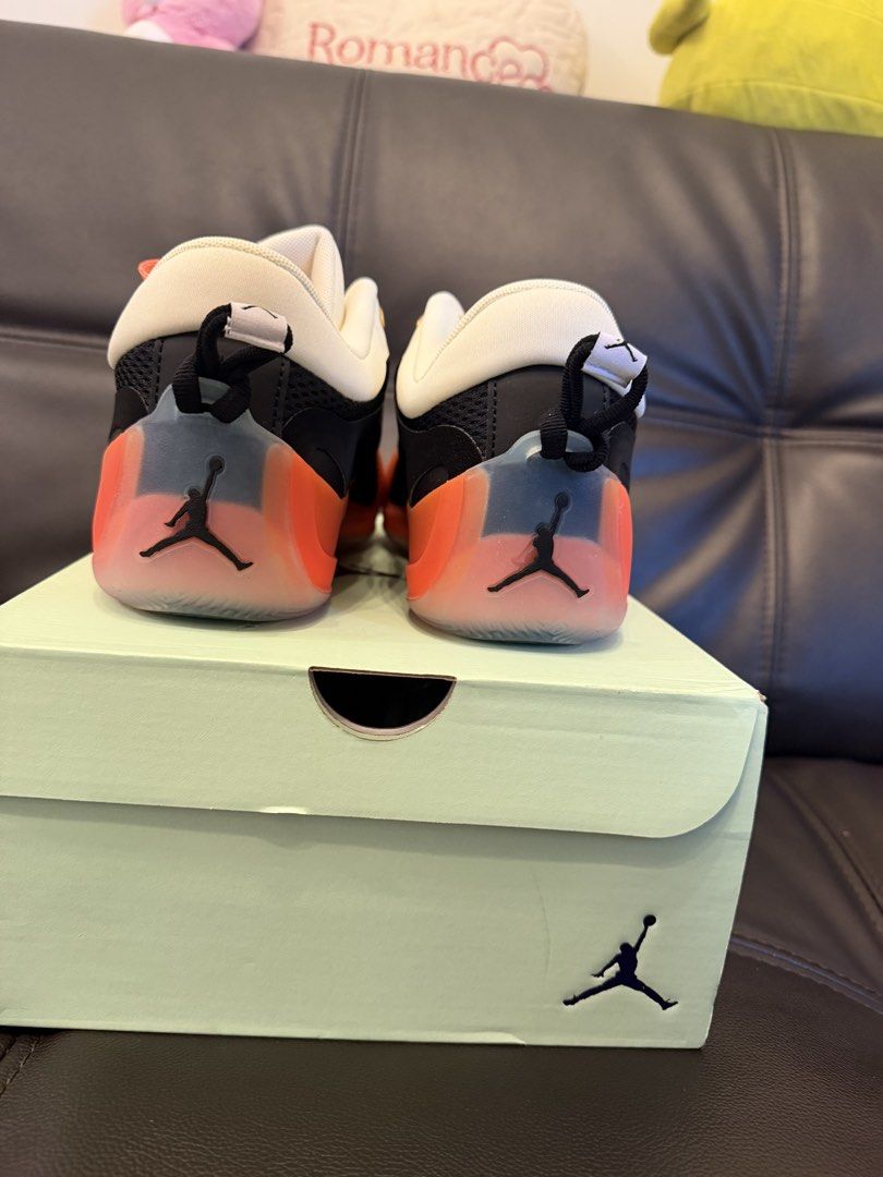 JORDAN (Category: Sneakers) located in Manila. Submitted by sellwithbelly (Listing ID 1470611164, Image 2). Description: - Model: Jordan Tatum 2 - Colorway: Black, White, and Orange - Condition: Brand new, never worn, pristine out-of-box condition - Special Details: WNBA gold tongue branding, Jumpman logos, bright coral patterned laces, and translucent orange midsoles - Performance: Equipped with responsive Air Zoom cushioning - Packaging: Includ
