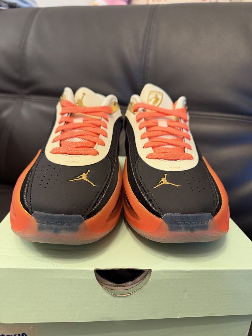 JORDAN (Category: Sneakers) located in Manila. Submitted by sellwithbelly (Listing ID 1470611164, Image 3). Description: - Model: Jordan Tatum 2 - Colorway: Black, White, and Orange - Condition: Brand new, never worn, pristine out-of-box condition - Special Details: WNBA gold tongue branding, Jumpman logos, bright coral patterned laces, and translucent orange midsoles - Performance: Equipped with responsive Air Zoom cushioning - Packaging: Includ