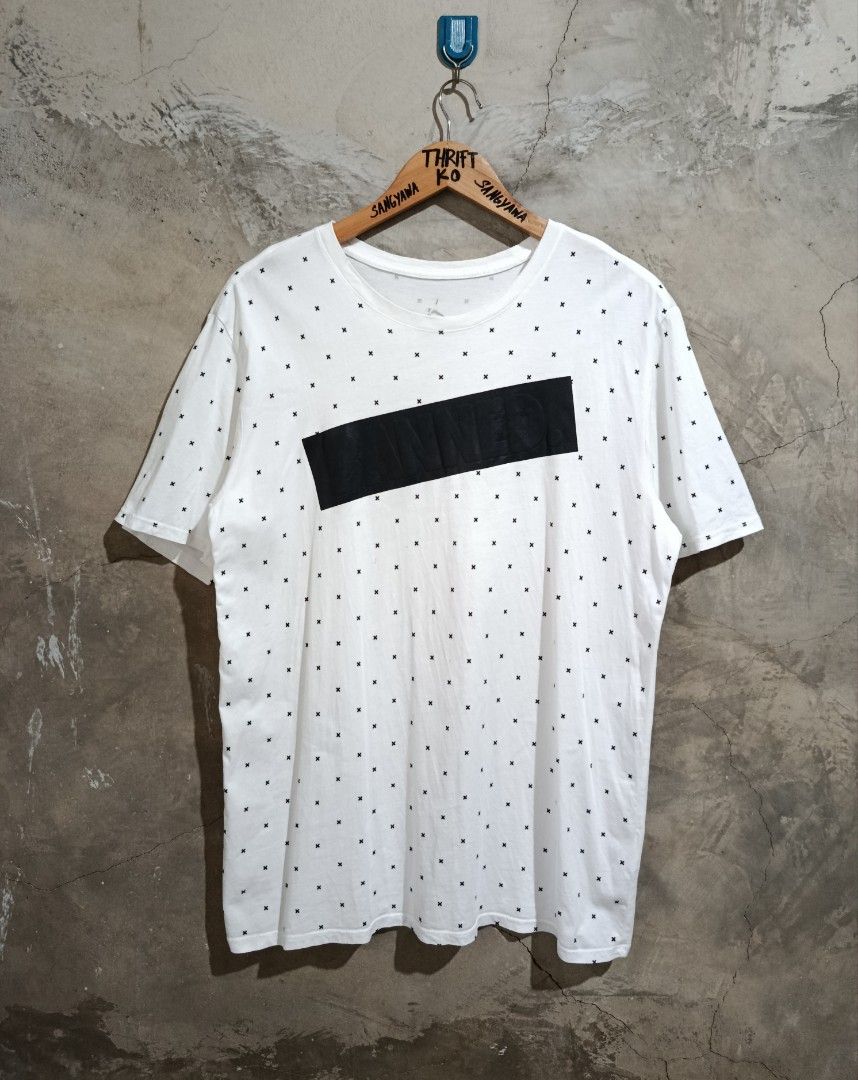 Jordan Banned White Cross Pattern Tee Large (Category: Tshirts & Polo Shirts ) located in Kalamansig. Submitted by skone1996 (Listing ID 1470618744, Image 1). Description: - Brand: Jordan - Color: White with black all-over cross print - Design: Bold raised 'BANNED' graphic on chest, small Jumpman logo on back collar - Size: Large - 21 Width - 27 Length - 9.8/10 Color rate - Issue Stain nasa two last pic . - Condition: Clean fabric, great for dail