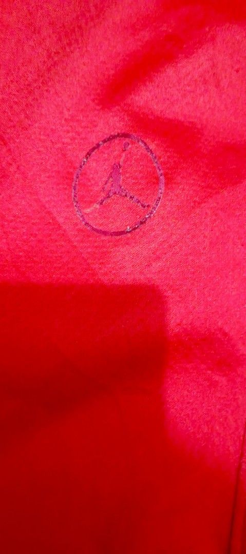 Jordan Dri-FIT Red Athletic Sweatpants Size S (Category: Joggers) located in San Juan City. Submitted by blueyohomeboy (Listing ID 1470688540, Image 2). Description: - Brand: Jordan - Color: Bright Red - Size: Small (S) - Material/Tech: Lightweight and breathable Dri-FIT technology - Features: Elastic waistband with adjustable drawstring, ankle zippers for easy on/off - Branding: Subtle Jordan Jumpman logo on left leg and small tag on side pocket