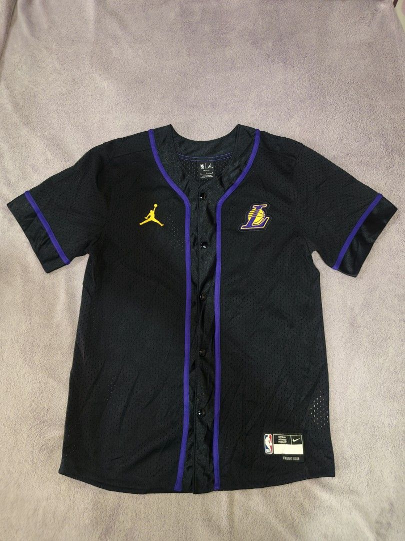 Jordan LA Lakers Statement Edition Button-Up Jersey Black (Category: Activewear) located in Bacolod City. Submitted by jimar4955 (Listing ID 1470742597, Image 1). Description: - Brand: Jordan (Official NBA Licensed Product) - Team: Los Angeles Lakers - Color: Black with purple trim and yellow accents - Size: L - Features: Button-up closure, breathable mesh fabric, Jumpman logo on right chest, Lakers logo on left chest - Condition: Excellent.