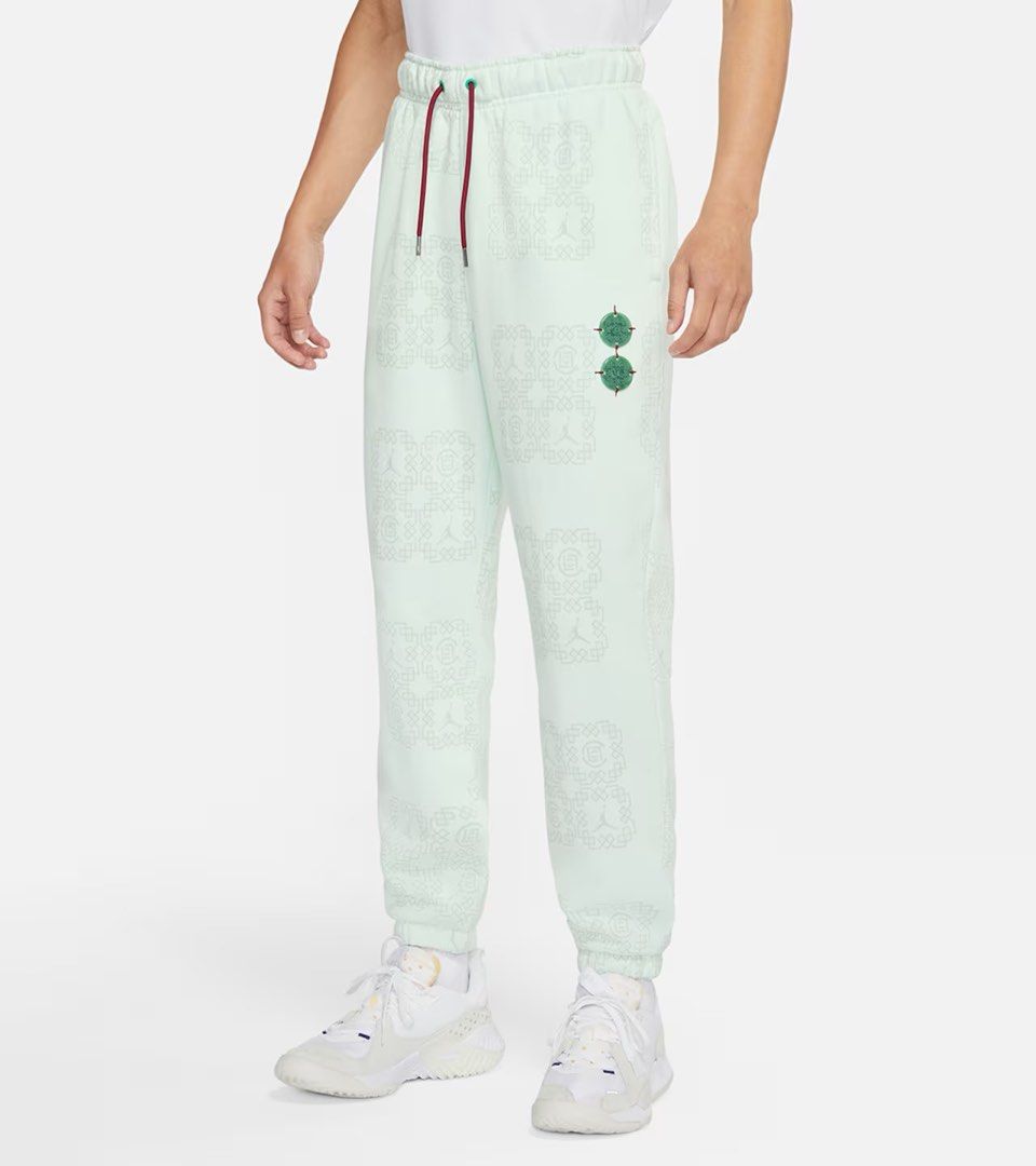 Jordan Sweatpants Mint Green (Category: Joggers) located in Manila. Submitted by angelll0123 (Listing ID 1470708260, Image 2). Description: - Brand: Jordan - Color: Mint green with maroon details - Size: Medium (Standard fit) - Condition: Brand new with original tag attached - Material: Soft, comfortable fleece for everyday wear - Design: Allover geometric pattern with iconic Jumpman logos - Features: Contrast maroon drawstring waist and unique g