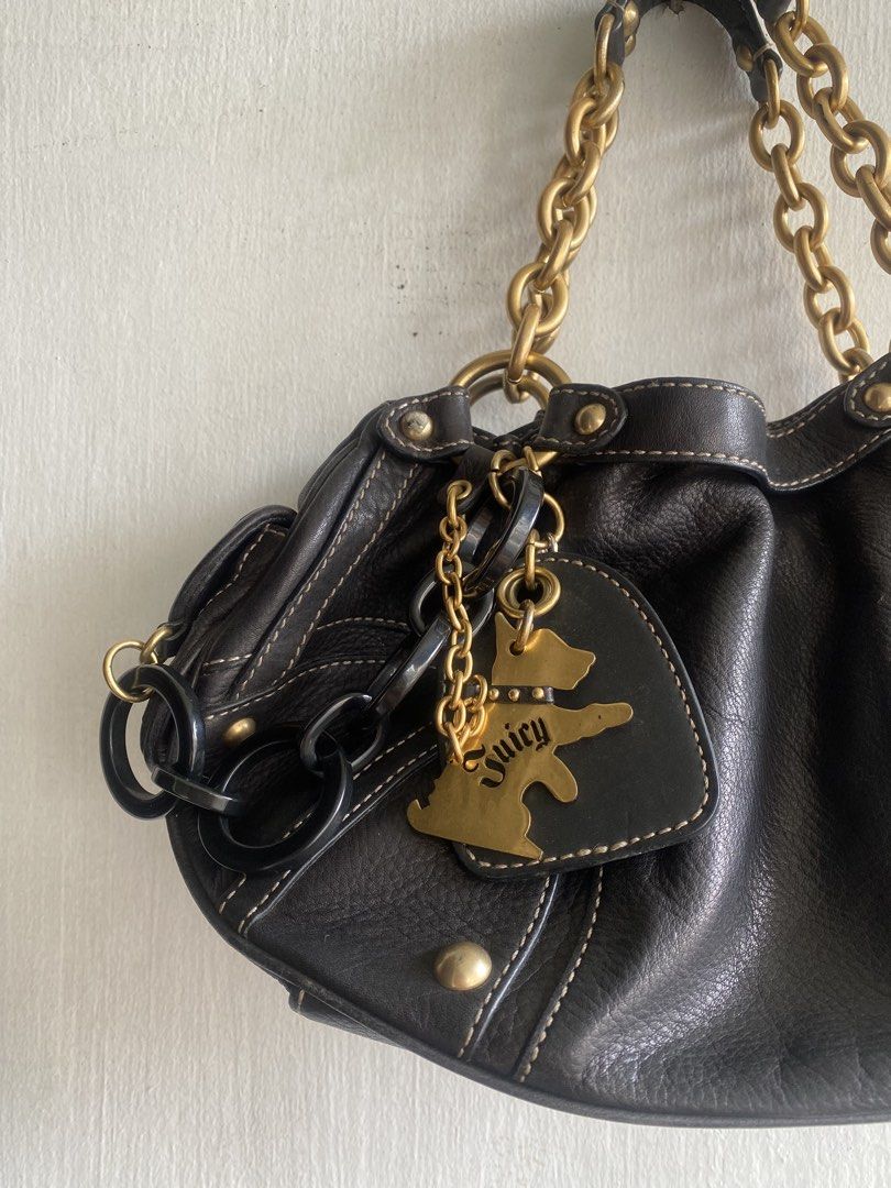 Juice Black Leather Shoulder Bag with Gold Chain (Category: Shoulder Bags) located in Manila. Submitted by anthony1723 (Listing ID 1470696959, Image 2). Description: - Brand: Juice - Material: Black leather with stylish contrast stitching - Straps: Chunky gold chain straps - Pockets: Exterior side pocket with gold-tone hardware and interior side pockets - Lining: Unique crown-patterned fabric interior - Extras: Playful dog charm and dark chain ha