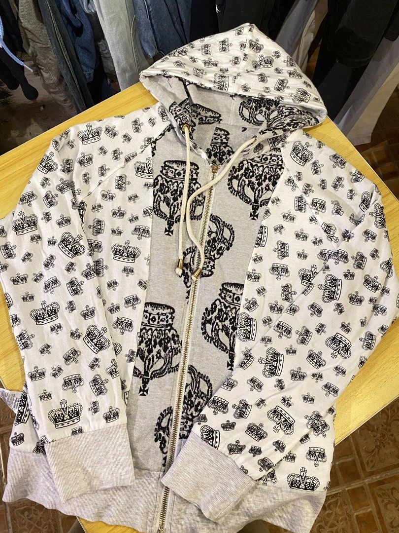 Juice Couture Crown (Category: Coats, Jackets and Outerwear) located in Manila. Submitted by thriftvibes324 (Listing ID 1470695868, Image 2). Description: - Brand: Juicy Couture - Color: Light grey with all-over black crown pattern - Size: L - Material: Cotton and polyester blend (machine washable) - Features: Zip-up front, drawstring hood, ribbed cuffs and hem - Condition: Excellent.