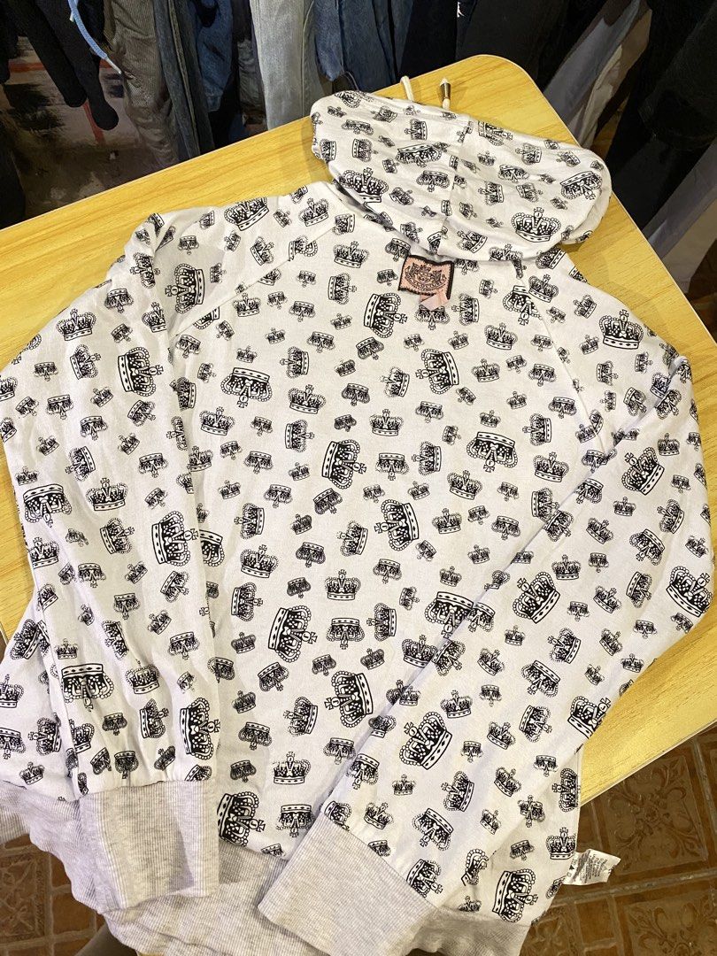 Juice Couture Crown (Category: Coats, Jackets and Outerwear) located in Manila. Submitted by thriftvibes324 (Listing ID 1470695868, Image 3). Description: - Brand: Juicy Couture - Color: Light grey with all-over black crown pattern - Size: L - Material: Cotton and polyester blend (machine washable) - Features: Zip-up front, drawstring hood, ribbed cuffs and hem - Condition: Excellent.