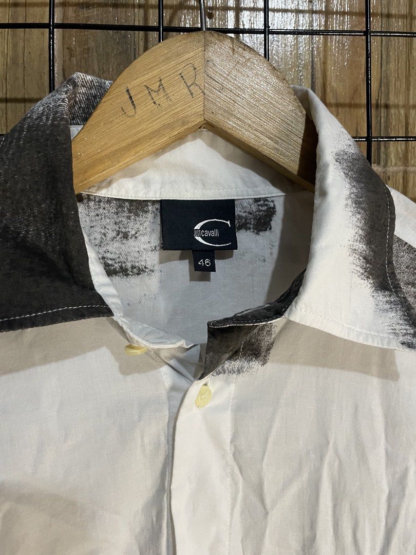 Just Cavalli button down shirt (Category: Luxury Apparel) located in Pateros City. Submitted by toogood.mnl (Listing ID 1470642250, Image 2). Description: Just cavalli button up shirt (Abstract design) W-20 L-28 No issue Excellent condition .