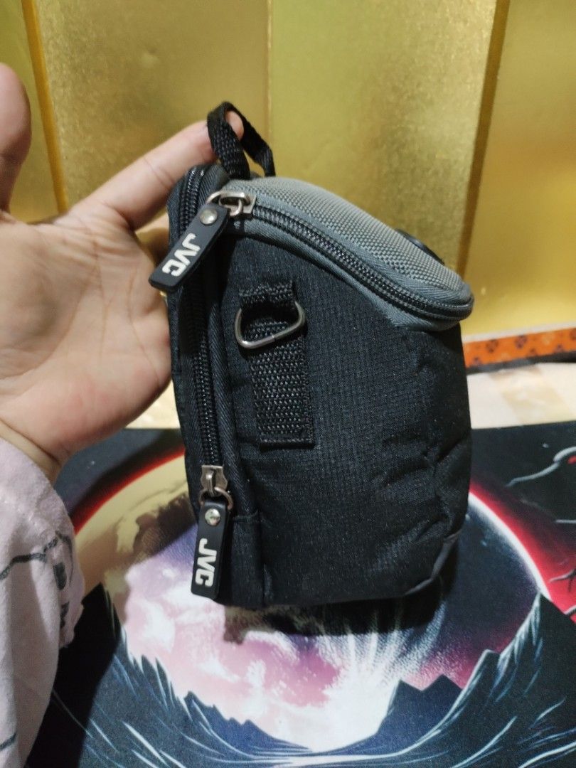 JVC Camera Pouch Bag Black Grey (Category: Camera Bags & Carriers) located in La Trinidad. Submitted by malditas (Listing ID 1470705644, Image 2). Description: - Authentic JVC camera pouch in a stylish black and grey design - Compact size with a sturdy zipper closure and custom branded pull From HT box BUY AS IS (NO RETURN, NO EXCHANGE, NO REFUND unless stated) LOCATION For dropping: BAGUIO- Mabini LA TRINIDAD - KM. 5 SHIPPING via J&T + SF paymen