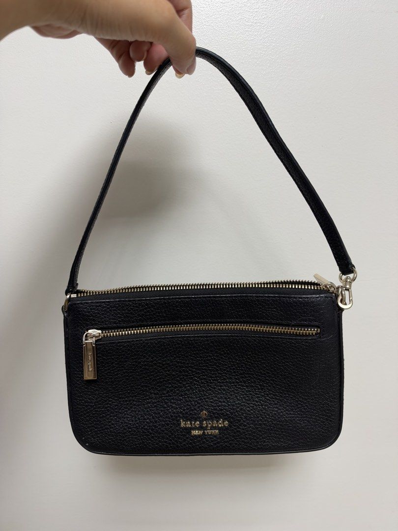 Kate Spade Black Leather Shoulder Bag (Category: Luxury Bags & Wallets) located in Manila. Submitted by cat-d526 (Listing ID 1470731306, Image 1). Description: - Brand: Kate Spade New York - Material: Black pebbled leather with gold-tone hardware - Closure: Secure top zipper closure - Pockets: Convenient front zip pocket with metal pull tag - Strap: Single detachable strap with swivel clasps - Design: Compact rectangular shape, perfect for daily 