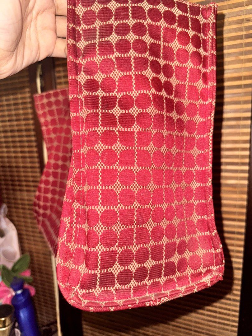 Kate Spade Tote Bag (Category: Tote Bags) located in Dumaguete. Submitted by dayvi143 (Listing ID 1470732789, Image 3). Description: - Brand: Kate Spade New York - Design: Red and beige pattern with dark brown leather double handles - Closure: Center strap with snap button - Interior: Spacious dark lining with 1 zipped pocket and slip pockets - Origin: Made in China - Perfect for work, travel, or everyday casual chic style - Price is still negoti