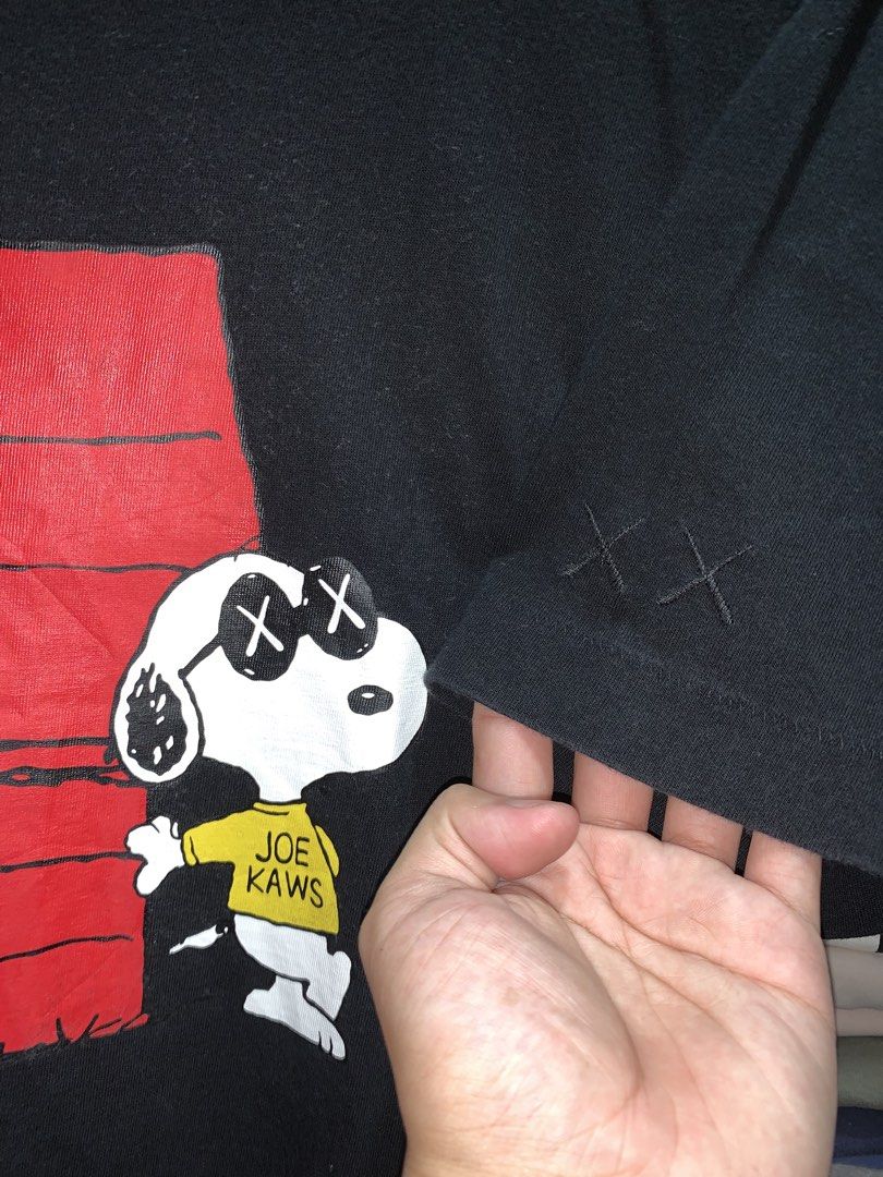 Kaws X snoopy (Category: Activewear) located in Manila. Submitted by consencino97571 (Listing ID 1470717468, Image 3). Description: - Brand: Uniqlo UT x Kaws x Peanuts (Triple Collaboration) - Color: Black - Size: Large - Material: 100% Cotton - Design: Snoopy graphic on front, iconic embroidered Kaws XX logo on the left sleeve - Details: Interior printed neck label, standard size tag, made in China - Condition: Excellent / Well-maintained - Mode