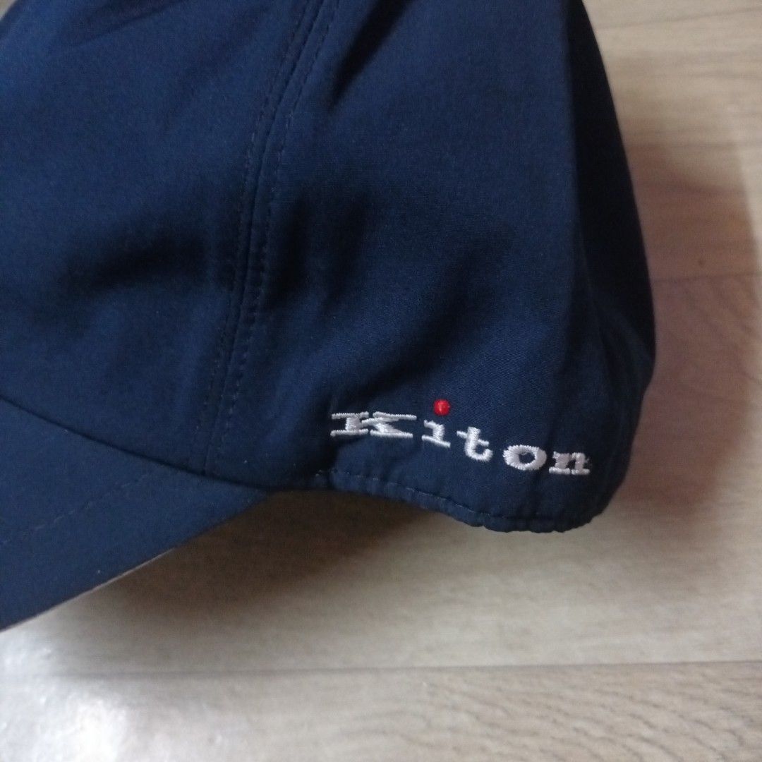 Kiton Napoli Navy Blue Cap (Category: Caps & Hats) located in Manila. Submitted by itsnik444 (Listing ID 1470636978, Image 2). Description: - Brand: Kiton Napoli - Color: Dark navy blue - Design: Classic curved brim with embroidered side logo and red dot accent - Interior: Grey lining with official brand tags - Fit: Adjustable strap at the back for a custom fit - Condition: Clean finish, ready to wear.