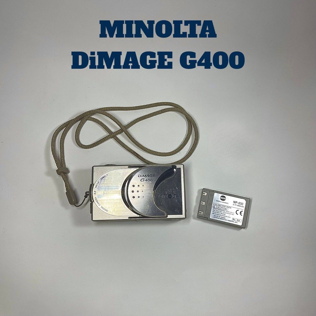 Konica Minolta DiMAGE G400 (Category: Cameras) located in Cavite. Submitted by gwythrifts (Listing ID 1470697440, Image 1). Description: Konica Minolta DiMAGE G400 Condition: 6/10 Issue: Burn lens, Hazy output, Cracked screen Inclusions: Battery, Bag, and Strap ₱ 1000.