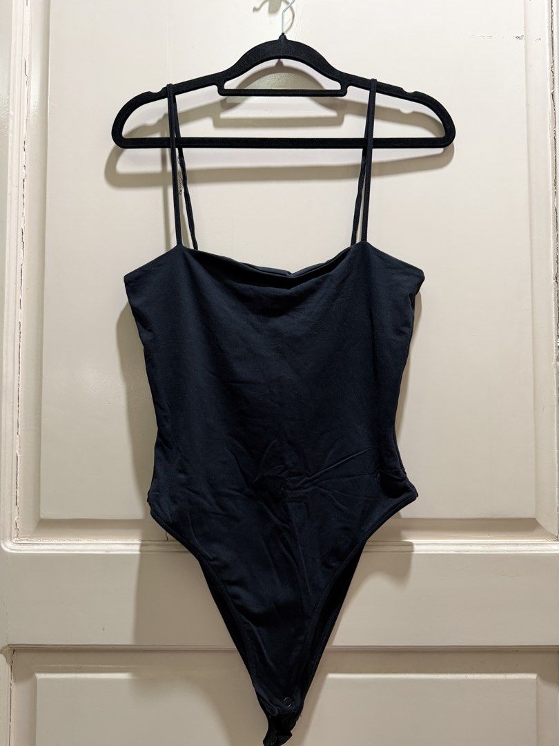 Kookai Black Cami Bodysuit Size 2 (Category: Sleeveless) located in Davao. Submitted by 2ndbase.dvo.ii (Listing ID 1470597211, Image 2). Description: - Brand: Kookai - Size: 2 - Color: Black - Style: Slim fit cami bodysuit with square neckline and double thin straps - Closure: Snap buttons at the bottom - Condition: Worn a few times, still in great shape - Perfect for: Easy styling with high-waisted jeans or skirts.