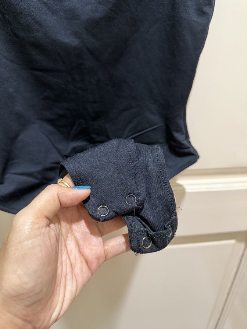 Kookai Black Cami Bodysuit Size 2 (Category: Sleeveless) located in Davao. Submitted by 2ndbase.dvo.ii (Listing ID 1470597211, Image 3). Description: - Brand: Kookai - Size: 2 - Color: Black - Style: Slim fit cami bodysuit with square neckline and double thin straps - Closure: Snap buttons at the bottom - Condition: Worn a few times, still in great shape - Perfect for: Easy styling with high-waisted jeans or skirts.