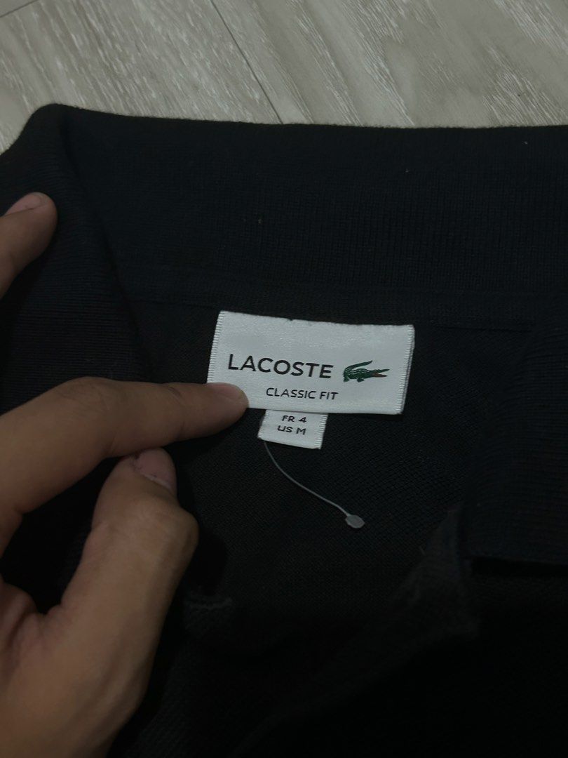 Lacoste black polo (Category: Tshirts & Polo Shirts ) located in Batangas. Submitted by jazthrift_ (Listing ID 1470649028, Image 3). Description: Lacoste: - Classic fit - Color rate: 9.5/10 - Complete tags - Medium on tag (us size) 20x25 -No issues 🏷️₱1,199 (free shipping).
