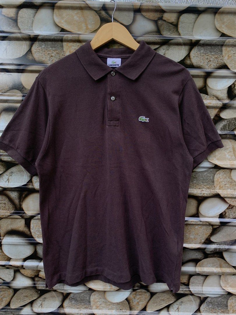 Lacoste Brown Polo Shirt Size 4 (Category: Tshirts & Polo Shirts ) located in Aloran. Submitted by chester78864 (Listing ID 1470668473, Image 1). Description: - Brand: Lacoste - Item: Polo Shirt - Color: Brown - Size: 4 - Material: 100% Cotton Pique - Origin: Made in Mexico - Design: Classic ribbed collar, two-button placket, and embroidered crocodile logo - Condition: Clean and ready to wear.