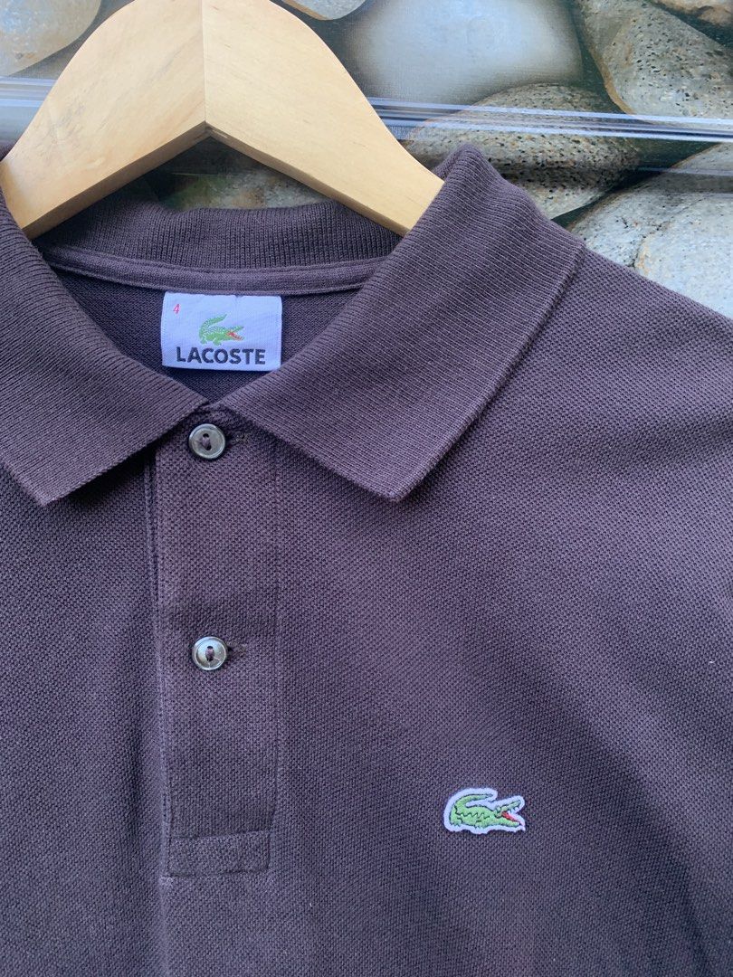 Lacoste Brown Polo Shirt Size 4 (Category: Tshirts & Polo Shirts ) located in Aloran. Submitted by chester78864 (Listing ID 1470668473, Image 2). Description: - Brand: Lacoste - Item: Polo Shirt - Color: Brown - Size: 4 - Material: 100% Cotton Pique - Origin: Made in Mexico - Design: Classic ribbed collar, two-button placket, and embroidered crocodile logo - Condition: Clean and ready to wear.