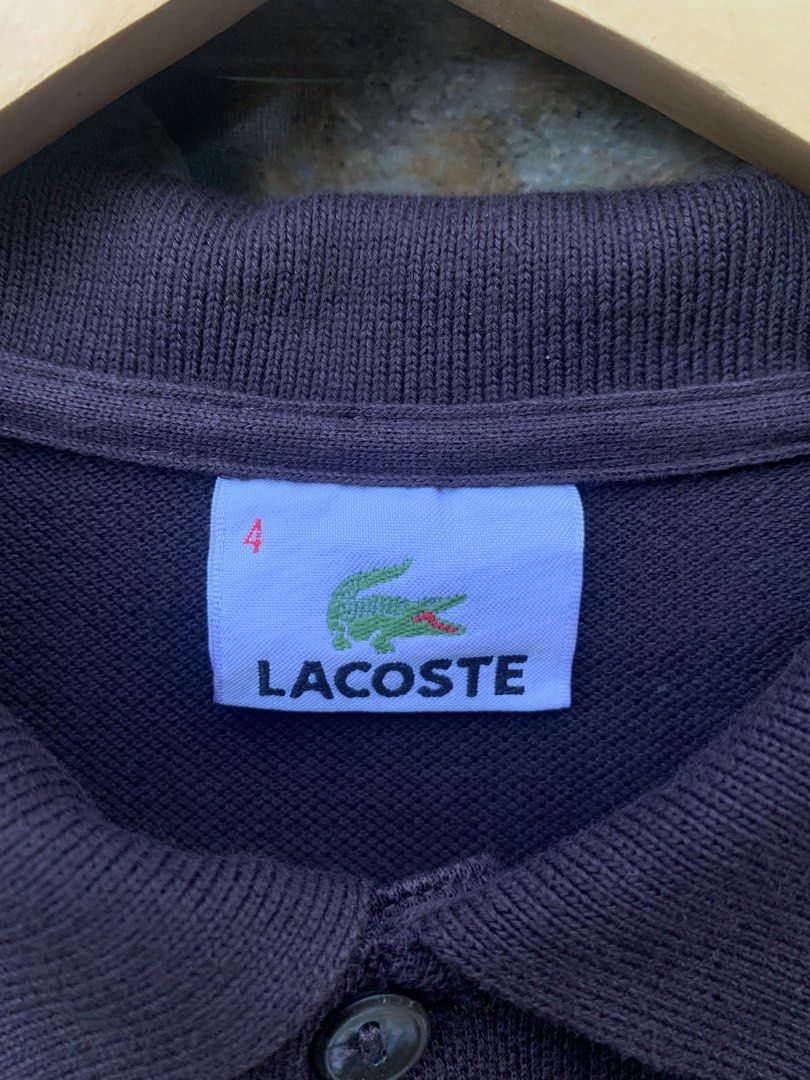 Lacoste Brown Polo Shirt Size 4 (Category: Tshirts & Polo Shirts ) located in Aloran. Submitted by chester78864 (Listing ID 1470668473, Image 3). Description: - Brand: Lacoste - Item: Polo Shirt - Color: Brown - Size: 4 - Material: 100% Cotton Pique - Origin: Made in Mexico - Design: Classic ribbed collar, two-button placket, and embroidered crocodile logo - Condition: Clean and ready to wear.