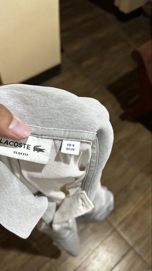 LACOSTE GREY (Category: Shirts) located in Manila. Submitted by urban.vintage (Listing ID 1470596046, Image 3). Description: ISSUE: PINHOLE (NEED WASH) MOP :GCASH (NO COD) SHIP VIA: LALAMOVE & J&T LOCATION: PASIG CITY LENGTH: 30 WIDTH : 19.