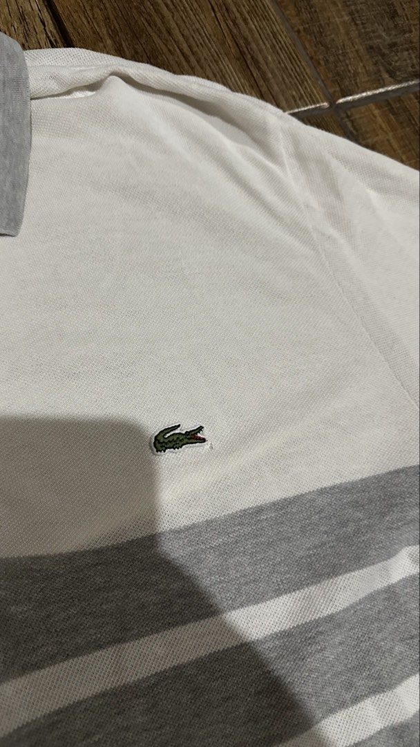 LACOSTE GREY STRIPE (Category: Tshirts & Polo Shirts ) located in Manila. Submitted by urban-vintage_2 (Listing ID 1470568770, Image 2). Description: ISSUE: PINHOLE ( NEED WASH ) MOP :GCASH ( NO COD ) SHIP VIA : LALAMOVE & J&T LOCATION : PASIG CITY LENGTH : 30 WIDTH : 19 .