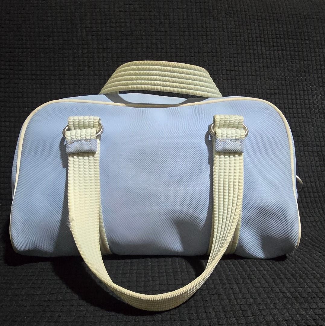 Lacoste Light Blue Barrel Handbag - Negotiable!!! (Category: Shoulder Bags) located in Manila. Submitted by axelyuna.27 (Listing ID 1470580770, Image 2). Description: Authentic light blue Lacoste barrel bag with cream handles and piping. Features dual zippers, green and white striped lining, an internal clasp strap, and the iconic embroidered crocodile logo. Compact and stylish for everyday use!.