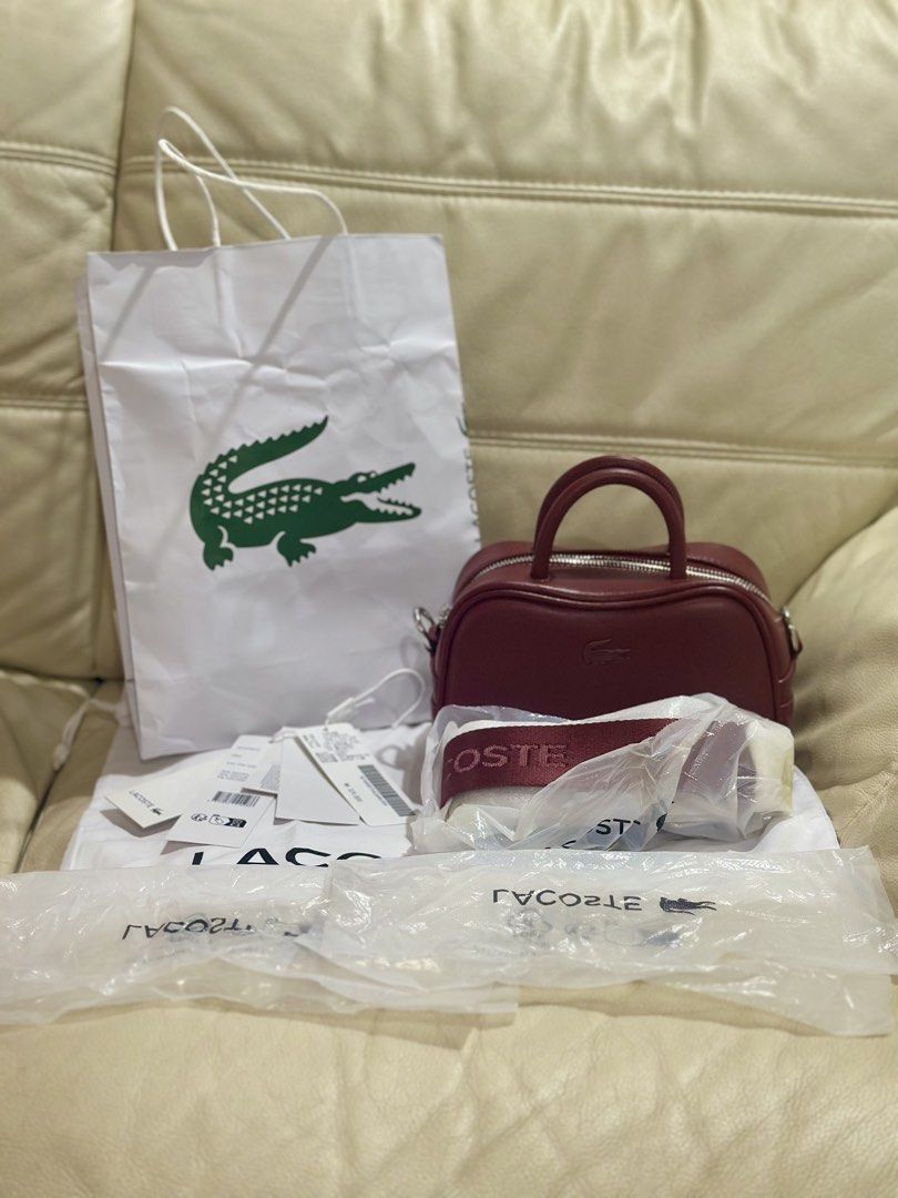 Lacoste LORA bag (Category: Cross-body Bags) located in Las Pinas. Submitted by k_archive (Listing ID 1470658434, Image 1). Description: • Lacoste LORA bag • Color: red • Size: xxs, top handle bag • Sling, guitar strap • Good as new, used only once • Bought from South Korea • Complete inclusions - paper bag, tags, dust bag.