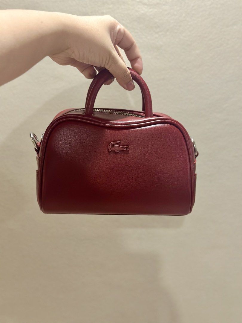 Lacoste LORA bag (Category: Cross-body Bags) located in Las Pinas. Submitted by k_archive (Listing ID 1470658434, Image 2). Description: • Lacoste LORA bag • Color: red • Size: xxs, top handle bag • Sling, guitar strap • Good as new, used only once • Bought from South Korea • Complete inclusions - paper bag, tags, dust bag.