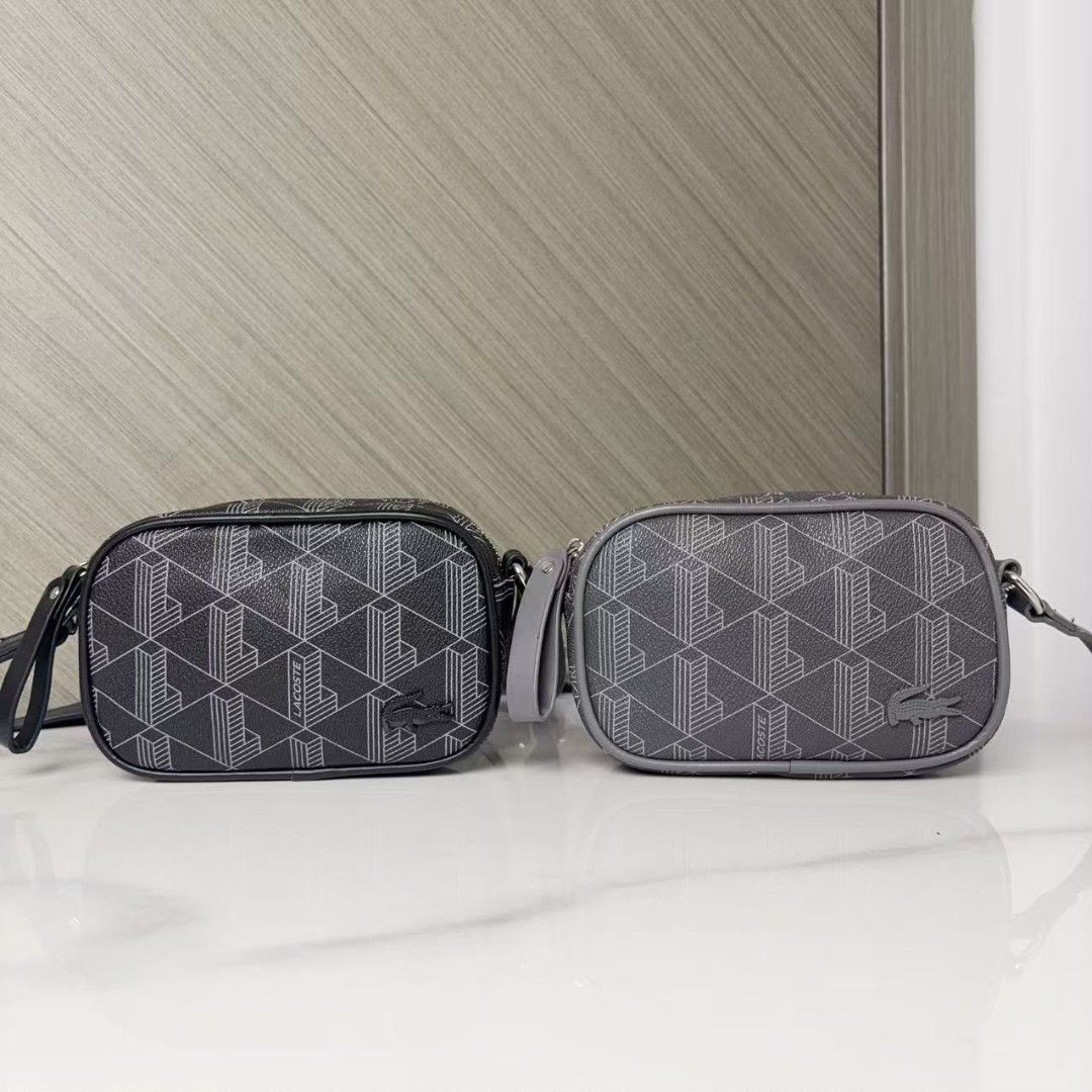 Lacoste Monogram Print Crossbody Bag (Category: Cross-body Bags) located in Caloocan City. Submitted by luckyocean_e40f38 (Listing ID 1470661121, Image 1). Description: - Authentic Lacoste crossbody bags available in two classic colors: Black and Grey - Features a stylish geometric monogram print on a textured surface - Compact rectangular shape complete with secure zipper closures - Includes attached wrist straps for versatile carrying options -