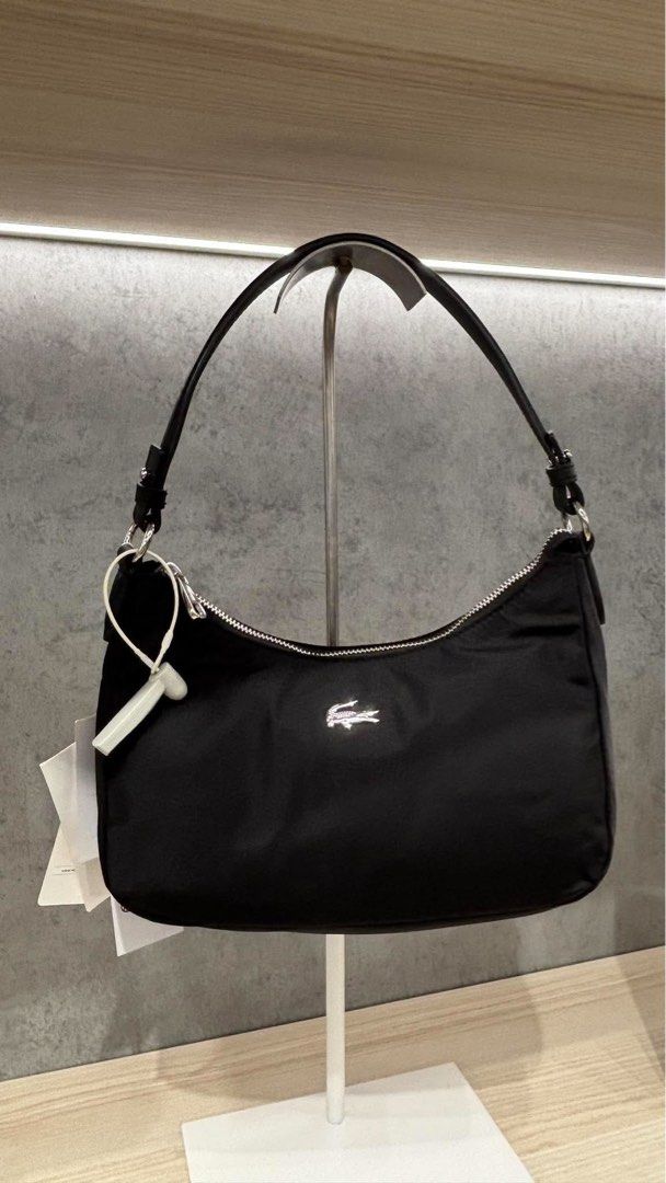 Lacoste Nylon Shoulder bag with strap (Category: Cross-body Bags) located in Legazpi City. Submitted by marthascollection19 (Listing ID 1470658516, Image 1). Description: .