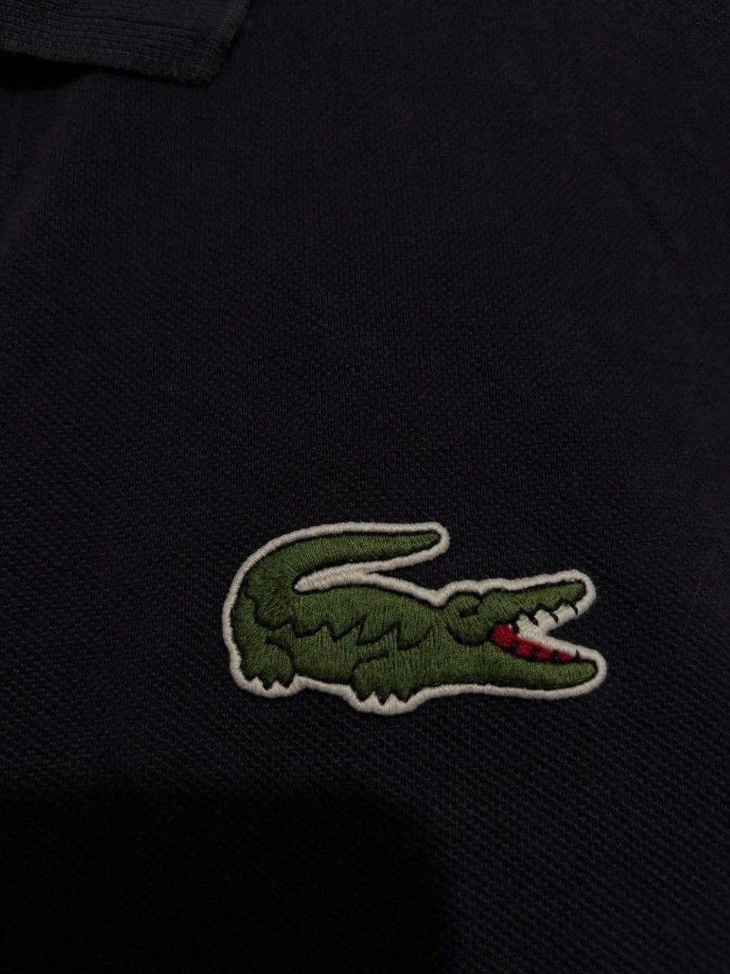 Lacoste Polo Shirt (Category: Tshirts & Polo Shirts ) located in Bauan. Submitted by onetwothrift2 (Listing ID 1470675957, Image 3). Description: Lacoste Polo Shirt Size: Med - Larde Dimes: L26 W21 Color rate: 9/10 Good condition No issue.