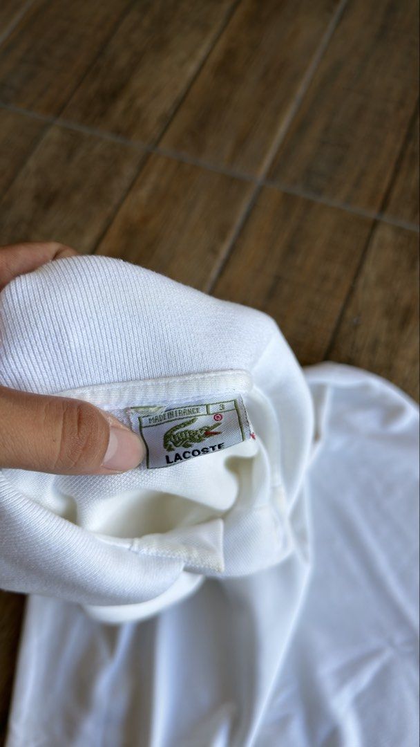 LACOSTE WHITE POLO (Category: Shirts) located in Manila. Submitted by urban.vintage (Listing ID 1470589137, Image 3). Description: ISSUE: NONE (NEED WASH) MOP :GCASH (NO COD) SHIP VIA: LALAMOVE & J&T LOCATION: PASIG CITY LENGTH: 28 WIDTH : 21.