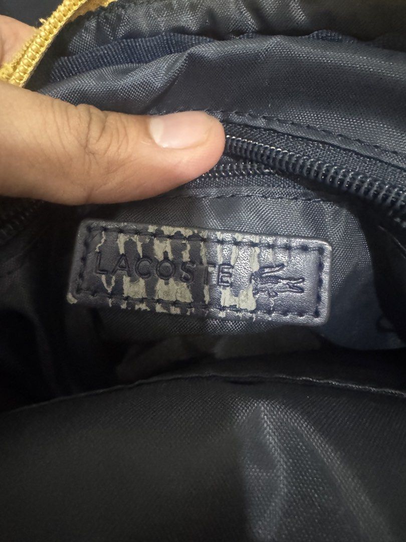 Lacoste Yellow Crossbody Bag (Category: Sling Bags) located in Manila. Submitted by misfits.ph (Listing ID 1470658461, Image 3). Description: Lacoste yellow sling bag Excellent condi see pics ₱1050 only Manila area Jnt lalamove.