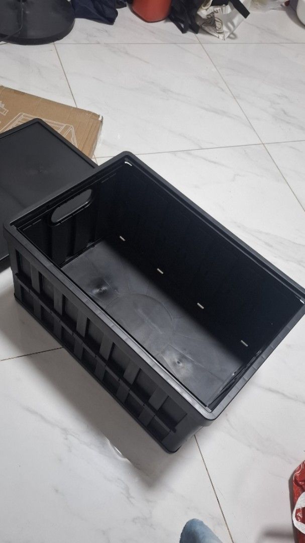 Large Foldable Plastic Storage Box Black (Category: Storage Boxes & Baskets) located in Pasay City. Submitted by froiexist (Listing ID 1470631259, Image 2). Description: - Color: Black - Dimensions: Approx. 50cm x 34cm x 26cm - Material: Sturdy plastic build with solid lid - Design: Collapsible for easy storage, with built-in side cutout handles - Ideal Use: Great for organizing clothes, snacks, or camping gear - Condition: Clean interior, excell